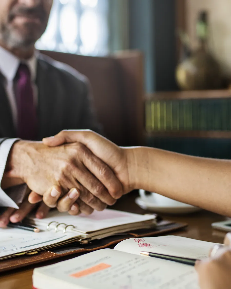 An attorney meeting with a client at Rubin & Badame, Attorneys at Law, P.C.
